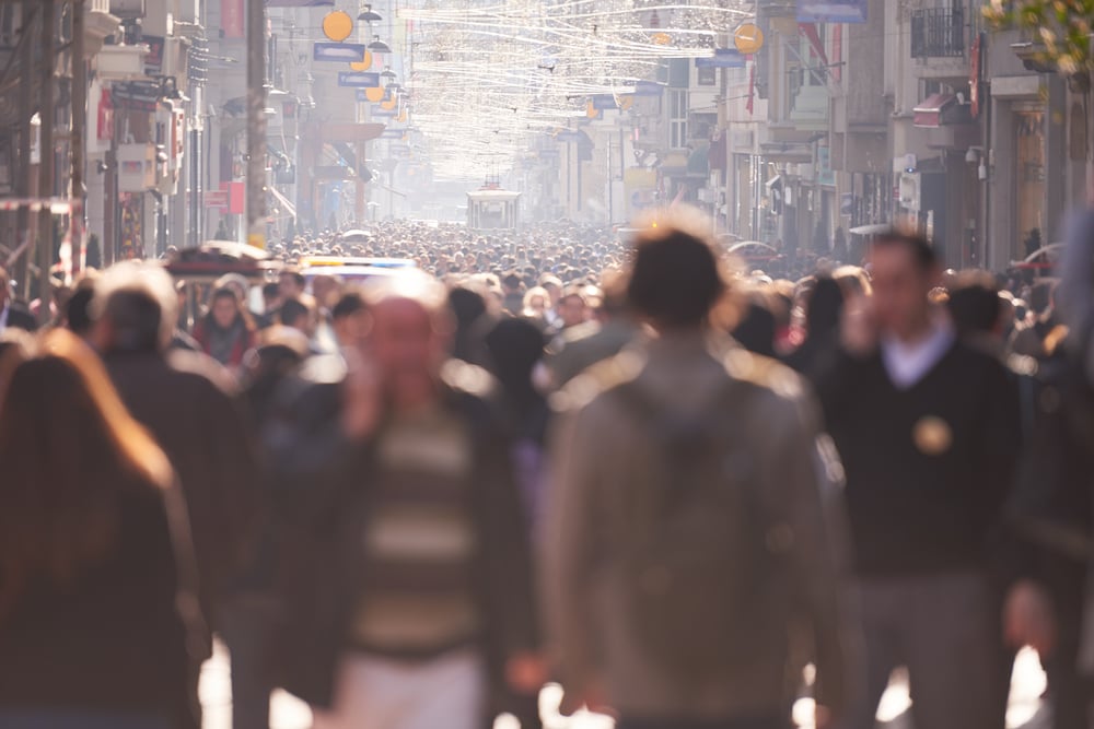 people crowd walking on busy street on daytime